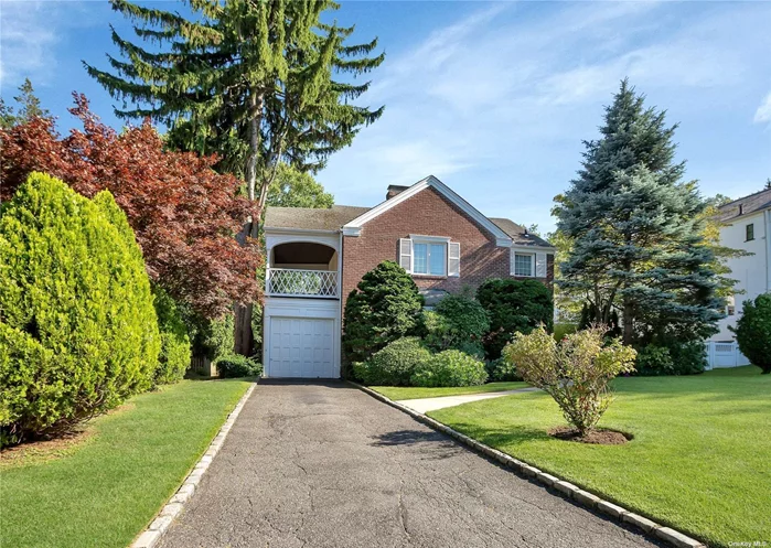 Discover this charming brick Manhasset colonial nestled in the sought-after North Strathmore neighborhood, just moments from shops, trains, buses, and schools. As you enter, the sun-drenched living room invites you in with its spacious layout and a large bay window, seamlessly flowing into a welcoming dining area and kitchen that overlooks the lush, well-manicured backyard - a perfect setting for outdoor enjoyment and entertaining. The second floor offers a spacious primary suite with a large private patio, two additional bedrooms, and a full bathroom. The basement presents versatile options, serving as a convenient storage area or an ideal space for a home gym, and features a washer and dryer for added convenience. With Manhasset Schools and a prime location, this won&rsquo;t last long. Schedule your viewing today!