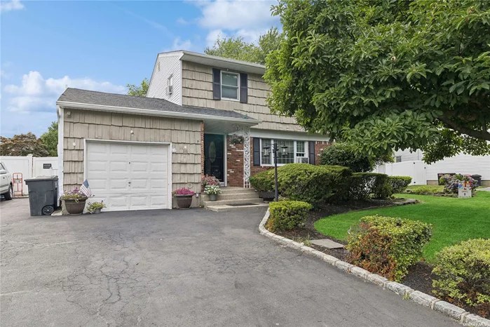 Step into classic elegance with this charming colonial home. Boasting four spacious bedrooms and 2.5 bathrooms, this residence offers ample space for you to flourish. The heart of the home is the open-concept kitchen with large quartz island, dining room, and living room where natural light floods through the sliding glass doors, illuminating the hardwood floors on 1st and 2nd floors. Prepare culinary delights in the well-appointed kitchen, complete with modern appliances and ample counter space on the oversized center island for effortless entertaining. The garage has been legally converted into additional living space, providing flexibility for a home office, guest suite or recreation room. Step outside to discover your own private oasis - a large patio awaits in the fenced yard, perfect for al fresco dining or basking in the sun. Retreat to the hot/cold outdoor shower for a refreshing rinse after a day of outdoor adventures. With its timeless charm, crown molding and modern conveniences, this property offers the perfect blend of comfort and style. Close to beaches and parks! Don&rsquo;t miss this opportunity to make this your forever home!