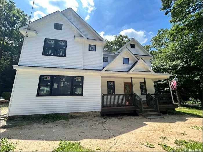 BRAND NEW COMPLETELY REBUILT COLONIAL GROUND UP. This home features 4 bedrooms and 2.5 bathrooms. 3 inch + oak floors throughout! The oversized luxury kitchen provides an open layout for entertaining and a large island with separate bar sink for easy access. The first level is open with large rooms and modern design. Home is built with Anderson 400 series black windows and new vinyl siding. Forced hot air and central A/C throughout. The first level has a beautiful mud room off the back of the house, perfect for post beach access. There is a half bathroom on the first level for all guests and upstairs you have 2 full bathrooms. The bedrooms are all built with oversized closets for ample storage. The primary suite features a cathedral ceiling, a massive walk-in closet and an oversized bathroom with separate soaking tub and stand up shower. The laundry room is located on the 2nd level for convenience. The lot is completely flat and usable just waiting for its new owner to make it their own. This home is also equipped with a state of the art septic system. This home comes with private beach access with an annual pass for a nominal fee.