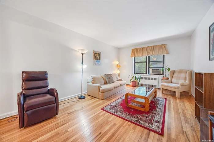 Discover the perfect blend of comfort and convenience in this delightful 1-bedroom apartment located in the heart of Jackson Heights. This cozy apartment features a spacious living room, a windowed kitchen, and ample closet space. The building offers an array of amenities, including a live-in superintendent, a bike room, an elevator, a laundry room in the basement, and an indoor parking garage (waitlist). Residents can also enjoy a beautifully maintained common garden with a charming turtle pond-a serene escape right at your doorstep. Subletting is allowed after just 2 years of ownership, providing flexibility for plans. Close to the 7 train station on Roosevelt Ave, offering easy access to Manhattan and beyond. Enjoy the convenience of being close to a variety of restaurants, supermarkets, and shops, making this apartment an ideal choice for anyone looking to experience the best of Jackson Heights living.