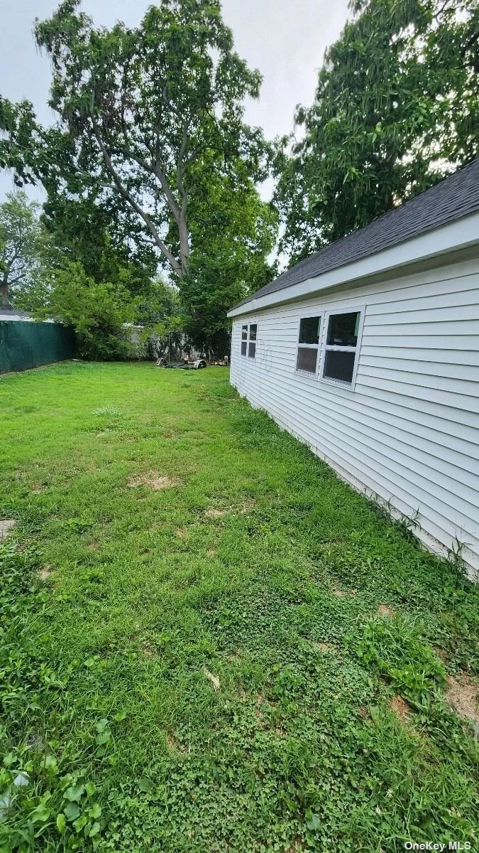 Large 600 square foot garage with three doors 2 on the front and one in the back with driveway and rear yard, Ideal for storage