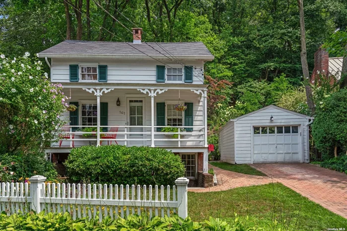 Originally built by John & Sarah Craft, this recently renovated 3 bedroom Colonial is situated across from Duck Pond and Gerry Park in the Historic District of Roslyn. The Living Room boasts wide plank pine floors, custom shelves & walls of windows overlooking lovely rear brick patio w/ stone wall & perennial gardens. Spacious original dining room w/ beamed ceiling is perfect for entertaining. Eat in kitchen has silestone countertops, new high end appliances with a door leading out to the front porch. Primary bedroom w/ wood burning FP has vaulted beamed ceilings & dressing room with new custom made closets. An outside entry into the lower level is ideal for home office or third bedroom ensuite. Wonderful attention to detail & craftsmanship. Convenient location to restaurants & shops.