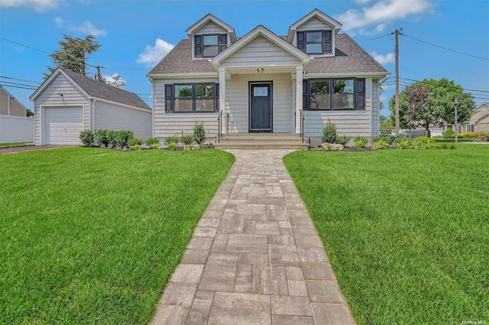 Welcome to your dream home! This beautiful cape - style home is situated on the corner of a quiet street for peaceful living, and lots of outdoor space. Located in the heart of Bellmore, this picture perfect home was renovated from the top - down with no details left out. With incredible craftsmanship throughout, this home offers a perfect blend of comfort and style. Featuring 4 bedrooms and 2 bathrooms, this home provides ample space for guests, or even a home office. Brand new stainless steel appliances including a sleek gas stove makes for cooking like a chef easy. The highlight of this charming home is the beautiful quartz center kitchen island providing tons of storage and also serves as a countertop to entertain.  Featuring new windows, new hardwood flooring throughout, new hot water heater, new plumbing, new electrical panel, sprinkler system, central air system, and roof. This home was designed for modern living with all the upgrades you need, and perfect for cozy and convenient living.