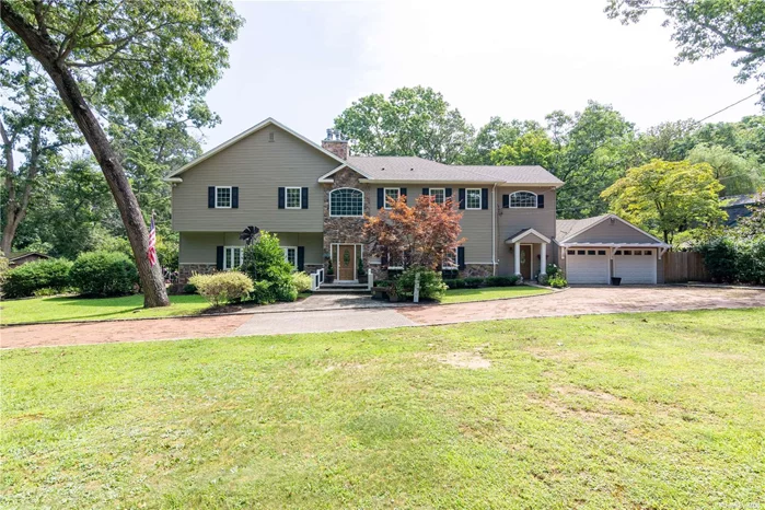 This stunning four bedroom home in the Smithtown School District offers a perfect blend of elegance and functionality. Nestled on a horse property with direct access into Blydenburgh Park riding trails, this home is a dream for equestrian enthusiasts. The property features four spacious bedrooms including a master suite with a Juliet balcony overlooking the serene yard. Cozy evenings can be enjoyed by the fireplaces in the primary suite and formal dining room, as well as the wood-burning stove in the living room. The kitchen is equipped with stainless steel appliances, double oven and warming trays. A family room and a large mudroom provide ample space for everyday living. The home also includes a full partially finished basement with both inside and outside access. Main laundry is located on the second floor. Additional amenities include a 2 car attached garage and a circular driveway. The property is fully fenced including the front yard, ensuring privacy and security. The beautifully landscaped grounds feature two gazebos and a pond. For horse lovers the property boasts a 4 stall barn, paddocks and a riding ring. The roof and heating system were updated as part of a comprehensive renovation in 2005. The home features hardwood floors and laminate floors and is freshly painted with new laminate flooring in 3 bedrooms. This property combines luxury living with the tranquility of nature in the sought after Smithtown school district. Don&rsquo;t miss the opportunity to own this exceptional house. Taxes are being grieved and expected to go down significantly.