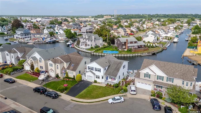 Location, Location, Location.... Fishermen and water enthusiasts paradise. This Beautiful Waterfront home is located on deep, wide, Hudson Canal. Home boasts an open floor plan with 3 Bedrooms, 2 1/2 baths, and is set in a quiet cul-de-sac. Current owners purchased the brand new home in 2001 and have lived there ever since. Deck with wide floating dock and ramp, is a boater&rsquo;s delight and allows kayaking, paddle boarding and swimming to be stress free. Loop Bridge is visible from the back deck and once through the bridge,  Jones Inlet leads you directly to the Atlantic Ocean. Central AC and natural gas heat will keep you comfortable all year round. Easy commute to NYC by LIRR and parkways are easily accessible. Gas fireplace for those chilly winter nights. Flood insurance is less than $1000 and the current policy is assumable by the new owners. ( Older 17ft Boston Whaler may be included with accepted offer/closing).