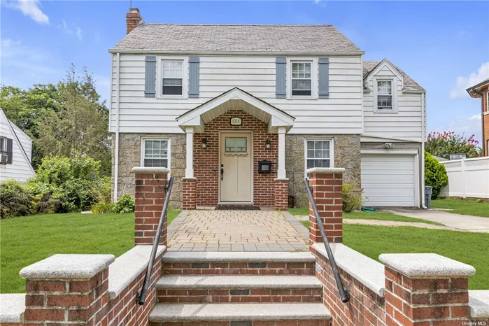 Beautiful 3 bedroom, 2.5 bathroom Colonial on 60x100 property in Little Neck Hills.  This 1940s style home has a separate entry foyer that leads into the large open living room with fireplace and formal dining room. Off of the spacious kitchen is a sunfilled den/office for added space. The first floor also offers a powder room, garage and backyard access.  With hardwood floors throughout the home, the second floor&rsquo;s roomy hallway leads to 3 bedrooms (including a large primary bedroom) and an updated full bathroom. There is also a staircase leading to the stand-up, windowed attic which is ideal for storage and any needed extra space.  The full finished basement has tiled flooring, a family room, laundry area, bathroom, storage, and separate room for utilities. The huge backyard has a patio area, deck area and lots of lawn to enjoy. The home has gas heat, private driveway, attached garage and is conveniently located within Little Neck Hills.