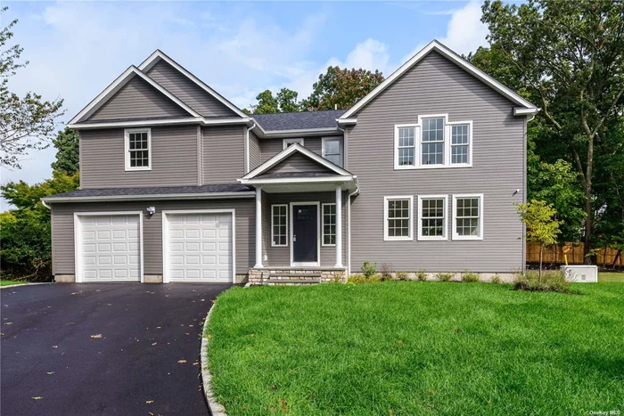 This house is ready to move right in !!!New construction! Picture perfect, classic center-hall colonial located at the end of a quiet cul-de-sac. Enter this 3, 300sqft, gracious home through the elegant entry foyer, with guest closet and powder room. This leads to the formal living room, flooded with light thru triple windows. The wide cased opening leads to the chef&rsquo;s eat-in kitchen with abundant cabinetry, Quartz counters, separate island, with seating. All stainless steel appliances including a built-in microwave, beverage fridge, stove with vent hood, refrigerator and 2 pantry closets. Kitchen is open to den with fireplace & sliders to patio. Primary suite has high ceilings, 2 ceiling fans,  walk-in closet, spa-like bath with large double shower (two entry door, two shower heads) double vanity and linen closet. There are three additional bedrooms, laundry room with storage, plenty of counterspace and sink and a full, and the main bath with tub completes this level. The full, unfinished basement lets you make that space your own and there is an outside entrance to the side property. Gorgeous finishes, great neutral decor and features include: white oak floors throughout, wainscotting, crown moldings, hi hat and LED lighting, granite counters in baths and laundry, propane gas fireplace, convenient entry into house from attached 2-car garage, energy star appliances, low-line septic system, all new Anderson windows, security system with cameras, tankless hot water system with on demand feature and so much more. The exterior has a sodded front yard, seeded back yard, 5-zone inground sprinklers and paver patio and walkways. This home is tucked away in a neighborhood location but conveniently located in central Suffolk, close to all. Transportation, parks, shopping, LIRR, local villages, schools and world class beaches. There is gas right in the street is fully available !!