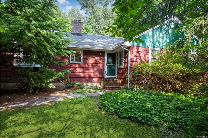 This home is a secluded nature retreat tucked away on a 0.5A wooded lot on a quiet street. This home is deceivingly large, a must see. Featuring a permitted 340sf accessory apartment (TOB -AA15851) - Approx 1000 ft. to Stony Brook University (Tabler Quad) - 5 minute drive to University Hospital. This 2300 sf home boasts a formal living room with fireplace, formal dining room, gigantic family room with french doors to the rear patio and french doors to the dining room, Eat-in kitchen with two pantries and energy star appliances, 3 large bedrooms, first floor laundry, powder room off kitchen, partial basement. Hardwood floors throughout the entire home. Closets galore. Oil hot-water heat, new central air conditioning. Accessory apartment includes a full kitchen, full bathroom, private outside entrance and off street parking. Taxes being grieved for the 2025/2026 year.