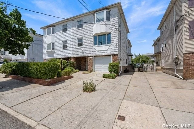 Split level apartment includes the garage and one spot for driveway parking, full access to the backyard; with a private fenced backyard and patio. Located in the heart of Bayside, come make this your home.