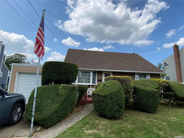 Make This Home Yours * Spacious Cape on A Quiet Block in a Great Neighborhood * Portico * Wood Flooring Throughout * Updated Windows * Newer Roof * Full Basement-Partially Finished W/Heat *