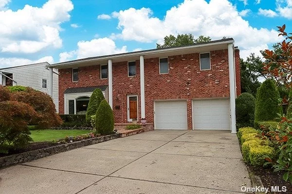 Colonial nestled in a cul-de-sac in Herricks schools 4 bedrooms and an extra den upstairs that can be converted to a 5th bedroom. Private backyard with lots of charm with a brick deck and fish pond. Kitchen opens to den with fireplace Lots of extras!