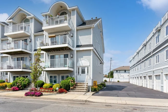 This upper townhouse condo is a stunning blend of modern luxury and coastal charm. Upon entering, you&rsquo;ll be greeted by beautiful hardwood floors that extend throughout the entire space, setting the tone for the high-end finishes and thoughtful design found in every room. The kitchen is a chef&rsquo;s dream, equipped with stainless steel appliances and granite countertops, offering both style and functionality for all your culinary adventures. The main level boasts two bedrooms and a full bathroom, perfect for loved ones or accommodating guests. Private washer/dryer for your convenience. The inviting gas fireplace in the living area provides a cozy atmosphere for those cooler evenings. One of the highlights of this home is the terrace, which offers breathtaking ocean views, making it an ideal spot for morning coffee or evening relaxation. Ascending to the upper level, you&rsquo;ll discover a massive primary suite that serves as a private retreat. This expansive suite features an ensuite bathroom, ensuring privacy and convenience, and a huge closet that provides ample storage for all your wardrobe needs. The suite also includes an alcove, perfect for a home office, reading nook, or creative space. Two private terraces extend from the primary suite, offering additional outdoor living spaces where you can enjoy the fresh ocean breeze and panoramic views. In addition to its beautiful interiors and stunning views, this townhouse condo comes with practical amenities such as a private garage and an additional assigned parking spot, ensuring convenience and security for your vehicles. Situated right across the street from the beach, this home offers immediate access to sun, sand, and surf, while being conveniently close to local shops, parkways, and the Long Island Rail Road (LIRR), making commuting and daily errands a breeze. This property truly embodies the best of coastal living with modern comforts and conveniences.