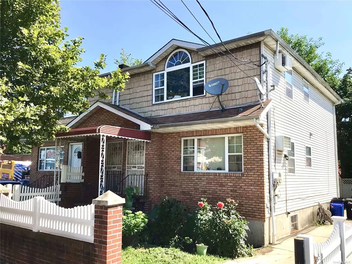 Live, Work, Invest! Check out this wonderful Multi-Family home in St. Albans, Queens This lovely home is a legal Two family with 4 bedrooms and 2 full bathrooms plus a full size basement for additional space. As you walk in you will have a beautiful living room with hardwood floors open kitchen and dining space. Further back you will have two spacious bedrooms with a full size bathroom. The top floor is great for additional income with this rental space mirrored as, the first floor with living room hardwood floors open kitchen dining and two bedrooms with a full bathroom. The basement has high ceilings two separate boiler, hot water heaters along with a half bathroom with laundry hook up and access to the back yard. This lovely home has a private driveway and back yard space for great outdoor entertaining. Close to USB stadium, Cross Island Pkwy restaurants and transportation.