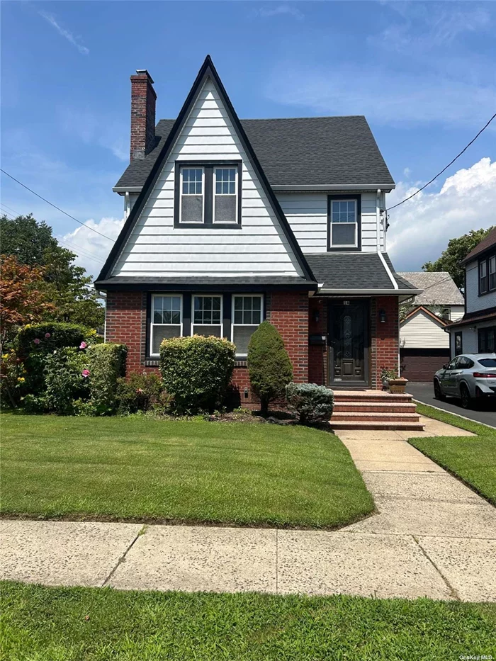 Location, Location, Location! Welcome to this stunning home in Floral Park, situated on a corner lot and within walking distance to public transportation such as the Long Island Railroad and buses. This beautiful residence effortlessly combines convenience and comfort in a highly desirable neighborhood.This home features elegant crown moldings and hardwood floors throughout, adding a touch of sophistication to every room. Every room is equipped with a ceiling fan to ensure a cool and comfortable living environment year-round. The spacious living room, complete with a cozy fireplace, offers a perfect spot to relax and unwind. The large dining room is ideal for hosting dinner parties and family gatherings, while the generously sized kitchen boasts gleaming granite countertops and modern stainless steel appliances-making meal preparation a delight. This home includes three bedrooms and two full baths. Additionally, the bathrooms, windows, and roof have been recently updated, ensuring modern comfort and efficiency. Both the electrical and plumbing systems have been upgraded to meet contemporary standards. For added flexibility, there are several bonus rooms that can easily be customized to fit your needs, whether as an office space or hobby room. The attic, with its high ceiling, presents an opportunity for a game room or additional living area. The finished basement features a bar, perfect for entertaining and celebrations. With its perfect blend of functional spaces and inviting atmosphere, this Floral Park gem is ready to welcome you home. Don&rsquo;t miss your chance to own a piece of this wonderful community!