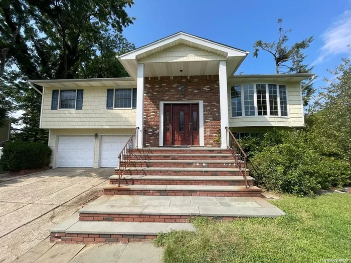 Sunny Hi-Ranch with 4 bedrooms and 2.5 bathrooms in the sought-after &rsquo;Candy Section&rsquo; of Commack. Features a bright living room/dining room, generous primary suite, and spacious den with a wood-burning fireplace. The beautiful flat half-acre property includes an in-ground pool.