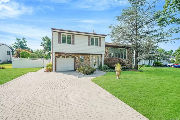 Welcome to this beautifully expanded 3-bedroom split-level home in the heart of Farmingville, NY. This unique property stands out with its impressive and spacious layout, offering much more than your typical split. The main level boasts a large expansion, featuring a stunning, oversized kitchen and dining area with vaulted ceilings and skylights, creating a bright and airy atmosphere. Adjacent to the kitchen is a generous family room, perfect for gatherings, with French doors that open to a private backyard oasis. Enjoy the inviting yard with its sparkling in-ground pool, ideal for summer entertaining and relaxation. The home also includes a front sitting room with gleaming tile floors, providing a warm welcome to all who enter. One of the rare splits in the area with a basement, this home offers a partially finished space that includes a laundry area, utility room, and additional storage. The second level hosts a formal living room, while the upper level is dedicated to the sleeping quarters, featuring a spacious master bedroom, two additional bedrooms, and a full bath. This home is perfect for those seeking a combination of space, comfort, and convenience in a desirable Farmingville location. Don&rsquo;t miss the chance to make this exceptional property your new home!