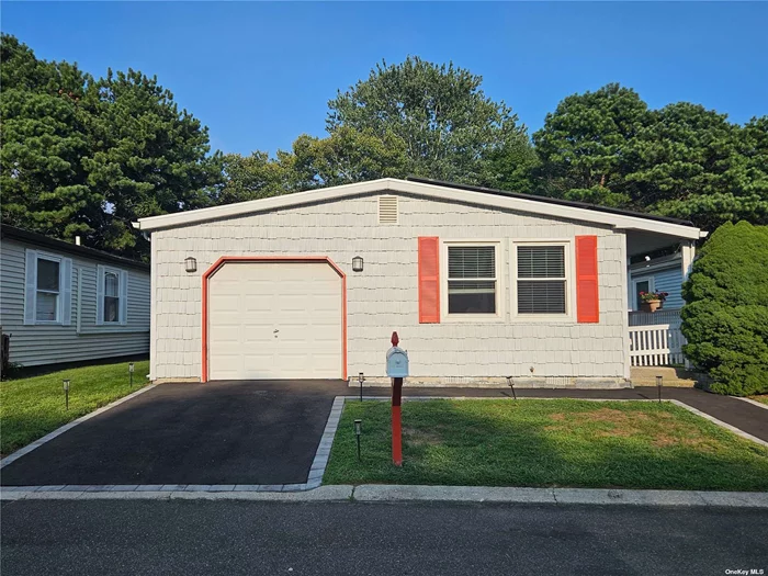 Welcome to this charming 2-bedroom, 2-bath home in an active, gated 55+ pet-friendly community. The open floor plan features a spacious kitchen with a breakfast bar, adjacent dining area, and a cheerful living room. Enjoy relaxing in the bright sunroom or step outside to the lovely deck. The primary bedroom suite includes a luxurious tub and separate shower, while the recently updated guest bathroom offers modern convenience. The primary bedroom is carpeted, with a walk in-closet and the rest of the home boasts elegant hardwood floors. The crawl space provides extra storage space! Additional highlights include a one-car garage with inside access, a beautifully paved driveway, and a front walkway. Benefit from leased solar panels for energy efficiency. The community amenities are superb, including a clubhouse with a gym, kitchen, game room, and workshop, as well as a pool, tennis courts, pickleball, bocce, RV parking and shuttle bus service to local attractions. Experience vibrant, comfortable living in this welcoming neighborhood!