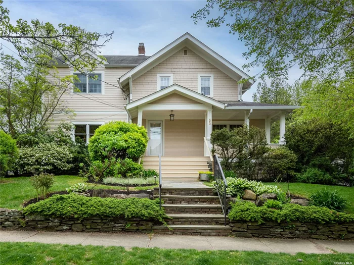 Expanded and renovated front porch Colonial featuring 3 bedrooms and 3.5 baths.