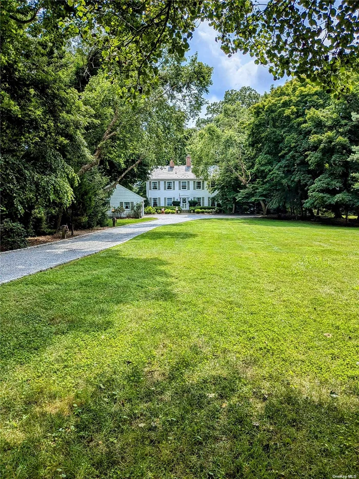 Classic colonial home on Conscience Bay with deepwater dock and beach frontage. Large eat-in kitchen, fireplace in front-to-back living room with pegged hardwood floor, and formal dining room on first floor, with a view of the bay from its southeast side. Fully finished lower level includes large den with a second fireplace, and a full bath, with glass sliders out to patio and backyard, which leads to water frontage. Substantial front yard and drive give considerable setback and privacy from road. Detached 2-car garage with electricity. Available unfurnished, partially furnished or furnished.