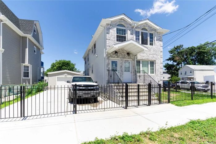 Brand New Beauty in Jamaica Queens: A Two-Family Gem! This stunning, brand new construction two-family home in Jamaica, Queens offers the perfect blend of style, space, and functionality.. The Details: - Beautiful Brick Facade: Makes a grand first impression on a beautiful tree-lined street. - Fully Detached: A complete privacy and peace of mind. - CORNER PROPERTY! - Two Spacious Units: - First Floor Apartment: Features 3 bedrooms and 2 full baths, including a large master suite with a private full bath. This unit also boasts a spacious living room and dedicated dining section, perfect for entertaining. - Second Floor Apartment: This expansive 3 bedroom, 2 full bath unit offers the ultimate living experience. Includes a large master suite with a private full bath, a spacious living room and a dedicated dining section. - Fully Finished Basement with a designated laundry area (washer & dryer included!), a full bath, and a separate entrance for added convenience. - Luxury Finishes: Both units boast beautiful kitchens with stylish cabinetry and stainless steel appliances. Fully tiled bathrooms feature Jacuzzis and vanities for ultimate relaxation. Every bathroom is a master bath! Gleaming hardwood floors flow throughout, recessed lighting throughout both units. Brand new plumbing and electric systems ensure worry-free living for years to come. - Private Driveway & a Detached Garage provides plenty of Parking space! Location, Location, Location! This exceptional property is close to everything including: - Shopping centers - Top-rated schools - Public transportation options for easy commuting - Major highways for convenient access to all points of interest. incredible opportunity! This brand new two-family home won&rsquo;t last long.