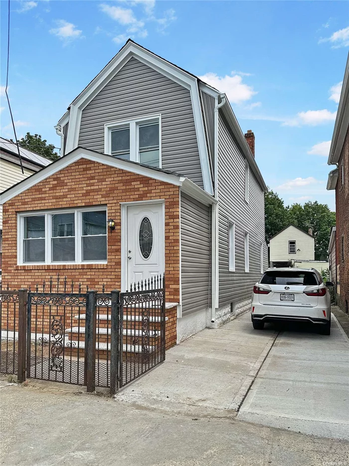 Completely Renovated 4-Bedroom Home with Private Driveway Welcome to 120-25 142 Street, where modern comfort meets timeless elegance. This beautifully renovated home offers 4 spacious bedrooms and 2.5 bathrooms, including a convenient first-floor bedroom. The property boasts a brand-new roof, gleaming hardwood floors, and updated appliances, ensuring a move-in-ready experience. The finished basement with its own outside entrance adds extra living space and potential for a home office or guest suite. Enjoy the privacy of a fenced property and the convenience of a private driveway. This home is perfect for those seeking both style and functionality in a prime location. Don&rsquo;t miss the opportunity to make this your new home!