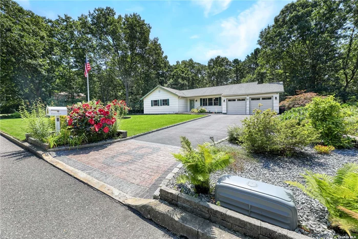 Step into this charming ranch, where every corner whispers home. The moment you step inside, you&rsquo;ll be embraced by a sense of warmth and comfort. This Manorville gem offers a spacious floor plan, featuring a cozy living room and an inviting eat-in kitchen with vaulted ceilings, stainless steel appliances, a skylight, and elegant Porcelain tiles. The formal dining room, with its sliding glass doors, invites natural sunlight to fill the room and offers a seamless transition to the serene backyard. Down the hall, unwind in your master suite complete with a walk-in closet, alongside two additional bedrooms and a full bathroom. The main floor&rsquo;s two full bathrooms are luxuriously equipped with radiant heated floors. On the opposite side of the home, you&rsquo;ll find a convenient laundry/mudroom with a custom pantry and soft-close drawers, leading to the attached heated two-car garage, complete with an EV charger. The fully finished basement is a versatile space, offering heat, full bathroom, media room, and ample recreational space - perfect for creating your personal retreat. The bilco doors provide easy outdoor access, and the home also comes equipped with an 8KW generator. Tucked away on over an acre of meticulously manicured grounds, this backyard is your own private sanctuary, complete with space to add a pool. The outdoor oasis boasts a deck, an expansive patio with custom pavers, elegant walkways, and a BBQ area, making it the ideal setting for entertaining friends and family. The large shed, equipped with electricity, enhances the property&rsquo;s versatility - perfect for extra storage. This outdoor space is where your dreams come to life. Don&rsquo;t miss your chance to make this exquisite property your own.