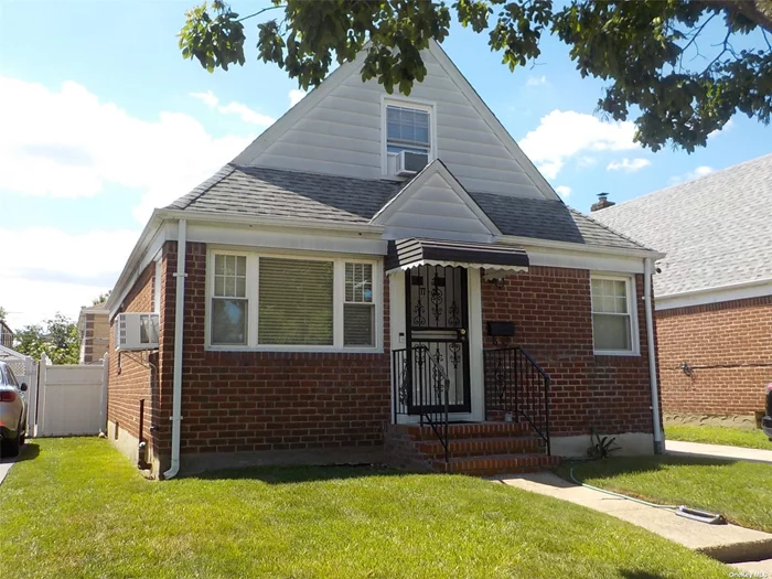 Well maintained Brick Cape, Close to all, 4 Bedrooms, Updated windows, roof, kitchen and bath, 100 amp electric, Spacious fenced yard, 1 car garage with storage. Steps to bus, shopping and schools. Favorable R3X zoning offers great potential for expansion / 2 family conversion, check with NYC DOB