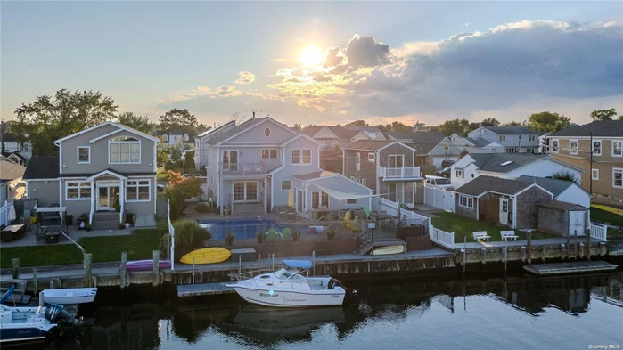 Cast Your Net on Coastal Bliss perched high on the widest canal in Massapequa Schmidt Canal!** Dive into coastal bliss with this fin-tastic opportunity south of Jefferson Avenue in South Massapequa! Anchored along the widest canal in Massapequa, this three-bedroom with potential for 4th bedroom or home office, plus additional sun room two-bathroom and garage is a catch with plenty of room for anyone dreaming of living the salt life. Peaceful and inviting front porch, beautiful wood floors , charming nook area, drop anchor next to your cozy wood burning fire place , central air conditioning, the Quint essential main bedroom balcony with sweeping views!You&rsquo;ll be hooked on Waterfront Living: Enjoy direct access to Schmidt Canal, perfect for casting your worries away and seconds to the all encompassing open bay and coveted Tobay Beach .Whether you&rsquo;re angling for relaxation or setting sail, this spot is a reel gem! Sixty Feet of water frontage with new decking. Make a Splash and take a plunge into paradise with your own inground pool with new liner, perfect for making waves with family and friends. Sea-ze the day with waterfront living! Finished basement with epoxy flooring awaits your personal touch, while a main floor office provides the perfect perch for work-from-home warriors. Or perhaps you want to make the additional sunroom your own personal office with views of the pool and beautiful waterfront ! Keep your sea legs with ample storage in the garage, ideal for stowing away your gear and tackle! Stay as cool as a Sea-Cucumber with central air conditioning and let the sprinkler systems keep your lawn shipshape without a drop of worry! This location is a shore thing, just seconds from the Great South Bay, soak in good times, sunsets and salty air. Get the net ready!! This one&rsquo;s a keeper, extremely desirable property taxes! (UNDER 14K AFTER STAR) Don&rsquo;t let this catch slip away! It&rsquo;s time to reel in the opportunity! You have been looking on the waterfront for a while , maybe even years. This one also has that pool you&rsquo;ve been looking for !!Is it a Fluke or fait? Opportunity is not a lengthy visitor!