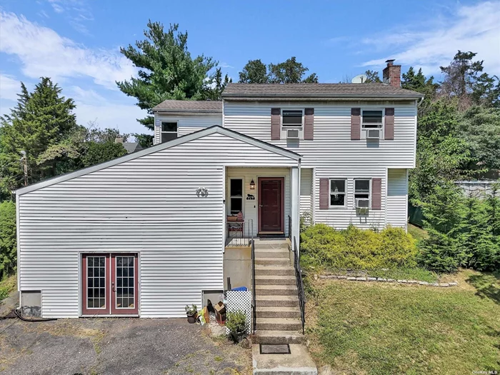 Sitting high in Rocky Point, this lovely 4 bedroom Colonial is move in ready! Lovely hardwood floors downstairs and new vinyl floors upstairs, EIK with new refrigerator and dishwasher machine, Formal dining room with sliders to the back yard. The primary bedroom offers privacy and a recently updated on suite bathroom.  The oil burner is 12 years old, and the above ground oil tank was just recently replaced! Tons of storage and bonus room down in the basement that has outside separate entry. The backyard has a large patio and plenty of flat space for backyard fun or pool in the future.  Just a short distance to Acres of Beaches where you can enjoy, Fishing, Swimming, Kayaking or just a lazy day at the beach.