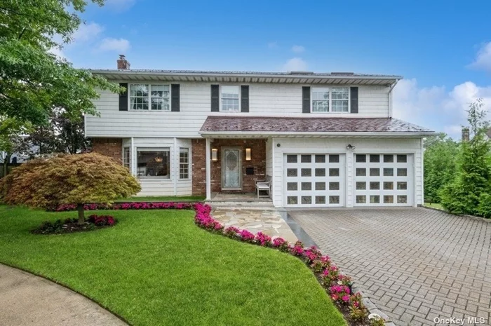 Step into this elegantly appointed side hall colonial, tucked away in a peaceful cul-de-sac. Custom touches throughout the home add to its appeal and practicality. The formal living room opens to a banquet-sized dining room, complete with French doors that lead to a gated patio and play area-perfect for hosting gatherings. The spacious den includes an office nook and a cozy fireplace. The expansive primary suite features two walk-in closets and a marble bathroom, accompanied by three additional bedrooms and another bathroom on the same floor. The finished basement offers two additional rooms, a playroom, and abundant storage. Additional features include a full water filtration system, security cameras, and a new boiler. This property exemplifies meticulous care and offers both convenience and serenity