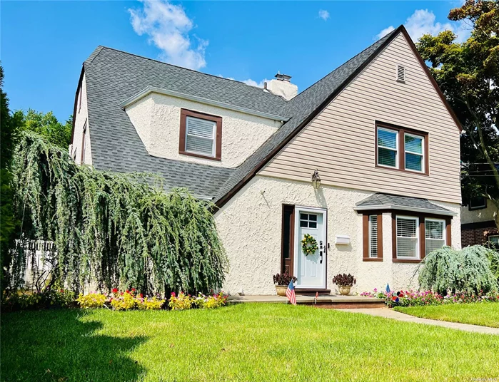 Bright and charming two-story Tudor with classic appeal and modern upgrades in the desirable Cathedral Gardens section. This home opens into an oversized living room with south-facing windows allowing for natural sunlight to fill the room during the day and a gas fireplace to keep you cozy at night. The original hardwood floors have been beautifully refinished and extend to every inch of the first two floors. An open formal dining room with plenty of built-in storage leads into a meticulously updated kitchen with new top-of-the-line stainless steel appliances, including a built-in double oven, and a huge quartz peninsula countertop with double-sided storage and bar-top seating. Upstairs you&rsquo;ll find three large bedrooms with plenty of closets, including a primary with vaulted ceilings and a walk-in closet. The updated hallway bathroom features a beautiful modern double vanity, and new deep soaking tub/shower. Every drop of water in the house is filtered by a recently installed AquaOx whole-house water filtration system, and you will never have to worry about running out of water with your new natural gas-fired wall-mounted Rinnai combi tankless hot water heater/boiler, leaving plenty of space to turn the basement into whatever you can imagine. A huge fully-fenced in well-maintained backyard with motorized retractable patio awning is perfect for entertaining, and a recently-constructed detached two-car garage means you will never run short on storage. An in-ground sprinkler system and central air conditioning system make this gem of a house always comfortable and easy to care for.