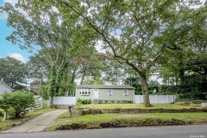 Lovely wideline ranch with updated Kitchen- Quart countertops, Wood cabinetry, tile backsplash, Stainless steel appliances and skylight! Wood plank floors throughout Living Room and Bedrooms. Subway tiled bathroom also with skylight. Full basement used as playroom and office. Great storage. Fenced yard. Close to beach, shopping and restaurants.