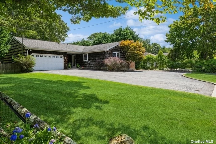 Welcome to 9 Oaktree Drive, East Moriches, a single level 3 bedroom and 1.5 bath Ranch home tucked away in a quiet neighborhood. The L-shaped living room has a brick faced wood-burning fireplace and a dining area with an open wall to the eat-in kitchen. An oversized 1 car garage has a ladder with access to the full attic that runs the length of the house. Plenty of storage in the full, unfinished basement. Sited on .43 acres with a fenced in yard with lots of lawn for games, a 16&rsquo; X 32&rsquo; heated inground pool with a patio surround and an elevated rear deck. The residence has deeded beach rights, and for $150 per year you can enjoy the bay beach and amenities in Newport Beach. Location offers easy access to points West and East.