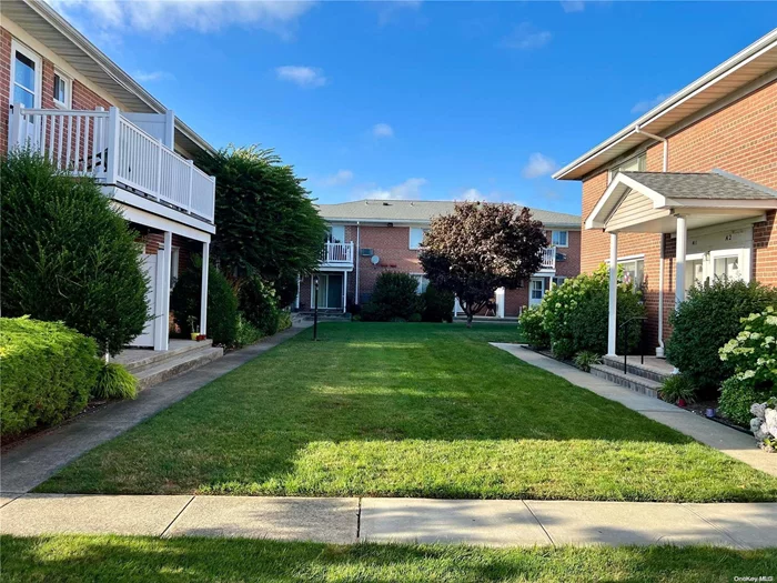 Spacious 2nd floor 4 room unit in Country Gardens features private entrance, a well manicured common area, living room, eat in kitchen with private balcony, full bath, bed, primary bed with custom walk in closet and in unit washer and dryer. wood floors. updates include: Full bath, carpet, crown mold and chair rail.