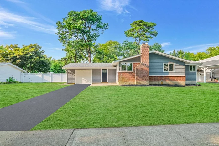 This beautifully renovated ranch home features three bedrooms, including a spacious primary suite with a full bath. The modern kitchen boasts quartz countertops, while wood flooring adds warmth throughout the home. An attached garage provides convenient parking and storage. Additionally, the property includes a full basement, offering ample space for storage or future expansion