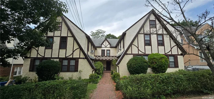 Remarkable Tudor-Style 8-Family Rent Stabilized Property in Douglaston, NY Nestled in the picturesque enclave of Douglaston, this hidden gem offers a unique investment opportunity. This legal 8-family Tudor-style building is perfectly positioned just a short distance from the LIRR and Northern Blvd, providing convenient access to transportation, shops, schools, and places of worship. The property features a mix of 4 one-bedroom and 4 two-bedroom units, The building boasts a detached 6-car garage.  A solid consistent income with lease. Four doors/entrance with two units each. . Key updates include a gas boiler installed less than three years ago, as well as a younger roof and windows. Each unit is adorned with beautiful hardwood floors, and second-floor units offer additional storage space with access to the attic. The basement is dedicated to utilities, ensuring easy maintenance. Set on a large, flat lot, this property combines historical charm with modern convenience, making it an attractive option for investors and residents alike. Selling As Is with tenants. Please respect tenants.  Public transportation including LIRR nearby, house of worship and shopping.