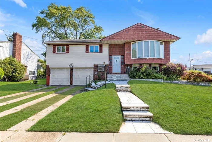 Great block, corner property, open concept floor plan, 2 full baths, new kitchen with island, 3 bedrooms and dual entry bath, wood floors throughout, lower level with open room den/bedroom, full bath, 2 car garage enters house. Completely wired for wifi smart house