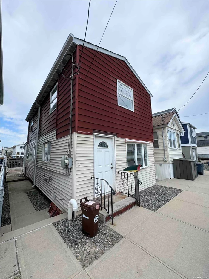 Welcome to 51 West 13th Road in charming Broad Channel, Queens! This inviting 2-bedroom, 1.5-bathroom gem offers comfort and peace of mind with its elevated position on a block expertly raised by the Army Corps of Engineers to prevent future flooding. As you step inside you&rsquo;ll find a spacious and bright living room, perfect for relaxing or entertaining. The large eat-in kitchen features plenty of space and a picturesque view of the back deck and serene canal. Imagine enjoying your morning coffee or hosting summer barbecues on this lovely outdoor space. Upstairs, you&rsquo;ll discover two generously sized bedrooms that provide a peaceful retreat with lovely views of the bay. A well-appointed full bathroom completes this level, adding to the home&rsquo;s convenience. Located in the tranquil and close-knit community of Broad Channel, this home combines coastal living with the charm of a scenic neighborhood. Don&rsquo;t miss your chance to make this special property your own!