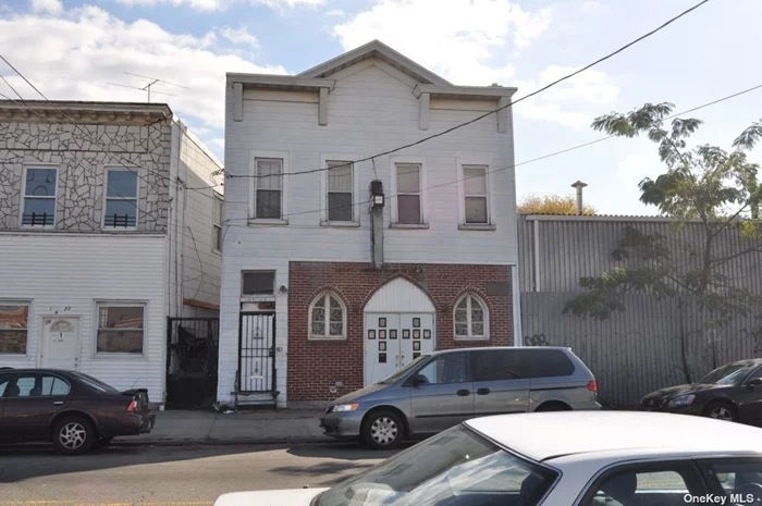 This property is a church on first floor and two apartments on 2nd floor