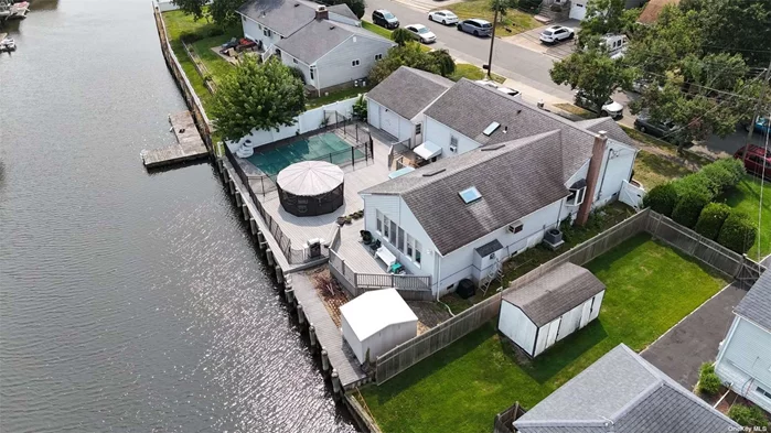 Come check out this beautiful waterfront home with over 80&rsquo; of bulkhead and an oversized 2 car detached garage on a quiet dead end street. This wonderfully located ranch style home is walking distance to shops, parks and the LIRR. It&rsquo;s less than a mile from the highway & 17 miles to NYC. It&rsquo;s the perfect home to enjoy a waterfront lifestyle while remaining conveniently located. This home is equipped with an eat-in-kitchen, stainless steel appliances, an oversized living room with cathedral ceilings, oversized walk-in-closet, beautiful wood floors, gorgeous views and much more! Bulkhead in great condition. This home is priced to sell, move-in-ready and WILL NOT LAST!