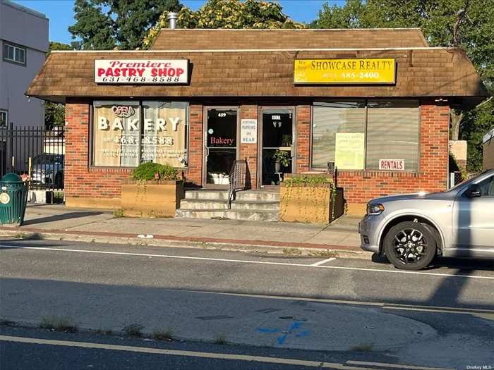 Opportunity knocks!! 4, 000 Sq. Ft. mixed use building. 2- 1, 400 Sq. Ft store fronts. 1 is a wet store and the other is office space. Second floor has a huge 2 bedroom apartment with a home office, and the property includes a 400 Sq.Ft detached building in the rear. Tons of off-street parking. The lot runs from Hawkins Ave to Carroll Ave. Located 2 miles from the train station and HUB. Super high visibility with great traffic count and exposure.