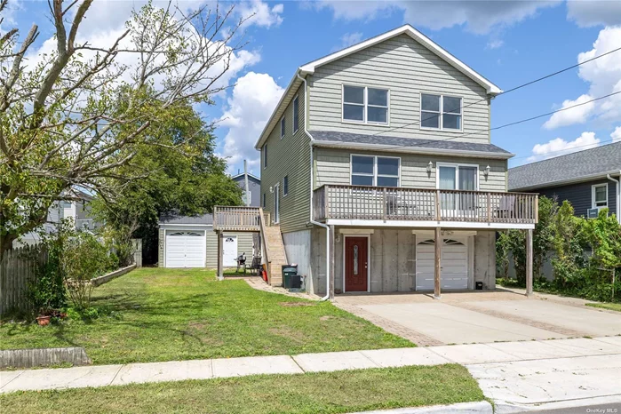 SPECTACULAR NEW (2017) FEMA COMPLIANT - SUNDRENCHED LEGAL 2 FAMILY ON LARGE 60&rsquo; x 100&rsquo; PROPERTY. 3 BEDROOM, 2.5 BATH HOME PLUS 1 BEDROOM, 1 BATH APARTMENT--- GORGEOUS SHAKER CABINETS W/ GRANITE COUNTERS, HARDWOOD FLOORS 2 DECKS,  GAS HEAT, 1 CAR ATTACHED GARAGE PLUS (!!!) A 2+ CAR DETACHED GARAGE & PRIVATE DRIVEWAY .BASEMENT AREA , SEPARATE ELECTRIC METERS