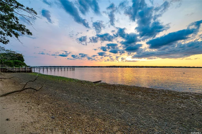 Shovel ready with approved plans and permits, experience waterfront living at its finest at 54 Rampasture Rd, Hampton Bays! This expansive 1.1-acre lot on Tiana Bay, the largest available vacant lot in Hampton Bays, offers over 140 feet of pristine shoreline. With building permits in place, you can break ground on the day of closing and begin crafting your dream home immediately. The property includes meticulously designed plans for a luxurious 4-bedroom, 4.5-bathroom new construction, featuring a 2-car garage, pool, basement, and approximately 3, 425 square feet spread across the first and second floors. Enjoy the grandeur of 10&rsquo; ceilings on the first floor and 9&rsquo; ceilings on the second floor, enhancing the home&rsquo;s spacious and airy feel. Additionally, there is an option to expand the lower level to include an additional full bathroom and 2 more bedrooms, transforming the home into a magnificent 6-bedroom, 5.5-bathroom retreat. For boating enthusiasts, there&rsquo;s potential for a permitted dock, providing direct access to the bay. This property is your gateway to creating a bespoke coastal retreat. Don&rsquo;t miss this rare opportunity to own a piece of paradise!