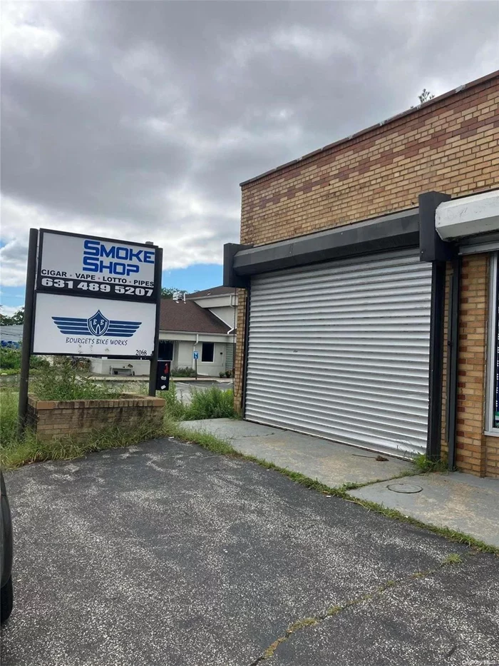 900+/- Sq Ft SHOP SPACE WITH OUTSIDE CANOPY; Excellent for Automotive, Motorcycle, Bicycle Repair, or other Shop type use. Has Compressor & Air Lines, Storefront & Signage.