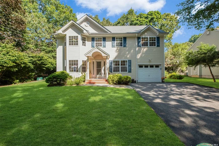 This stunning colonial home, built in 2003, offers an exceptional blend of luxury and comfort. The master suite features beautiful cathedral ceilings, a jacuzzi tub, and a double vanity for a spa-like retreat. Rich hardwood flooring extends throughout the entire house, adding warmth and elegance. The sun-filled living room, highlighted by a large bay window, flows seamlessly into a cozy den with a wood-burning fireplace. The eat-in kitchen boasts granite countertops, custom cherrywood cabinets, and updated appliances. The fully finished basement includes a convenient laundry room with a sink. Located in a top-rated school district, this special home is ready for you to make it your own.