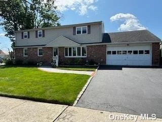 Single family home with the possibility of making into multi generational, or make your dream 6 bedroom colonial. All the major work is done! 1st floor has a Flvr, Fdr New Eik w/french doors to an inviting deck, 3 bedrooms and a new fbth. 2nd floor features, 4 bedrooms, Flvr, Eik and a Fbth. But wait, theres more! CAC, Full finished basement w/wetbar, and lndry room and an attached oversized 2 car garage. Close to Houses of worship, shopping, transportation and medical facilities