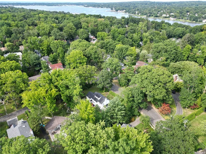 This beautifully all renovated French Tudor is a true gem, set on a lush 1/2+acre lot in a private, manicured setting. The home features a grandeur of high ceilings and exquisite details throughout, creating an atmosphere of sophistication and comfort. The bright and airy living room is bathed in natural light, offering a welcoming space for relaxation. The formal dining room and den provide versatile spaces for family gatherings and entertaining. The heart of the home is the spacious Euro granite eat-in kitchen, equipped with brand-new appliances for culinary adventures. The main floor includes a luxurious master suite, a guest suite, a convenient powder room, and a laundry room. The second floor boasts an additional master suite, along with four more bedrooms and three full baths, ensuring ample space for family and guests. The finished basement offers extra living space with endless possibilities. Recent upgrades include new plumbing, electrical systems, bathrooms, kitchen, central air conditioning, landscaping, and driveway. This home is ideal for a large family, offering both elegance and functionality. Enjoy the convenience of walking to nearby parks, schools, and places of worship.