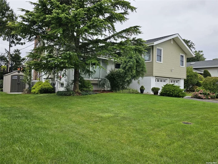 Welcome to your dream home! This stunning split-level house in Jericho (Syosset SD) has been meticulously renovated to offer modern luxury and comfort. Nestled in East Birchwood, this home offers: Spacious Living Areas: The open-concept living room features large windows that flood the space with natural light, highlighting the elegant hardwood floors and contemporary finishes. Modern kitchen, gourmet-equipped and beautifully finished opens to a breath-taking patio. Stylish four bedrooms with separate bath in master bedroom. Versatile Lower Level: The lower level offers a cozy family room with a fireplace, laundry and utility room. Outdoor Oasis: Step outside to a beautifully landscaped backyard with a spacious patio, perfect for summer barbecues and outdoor gatherings.