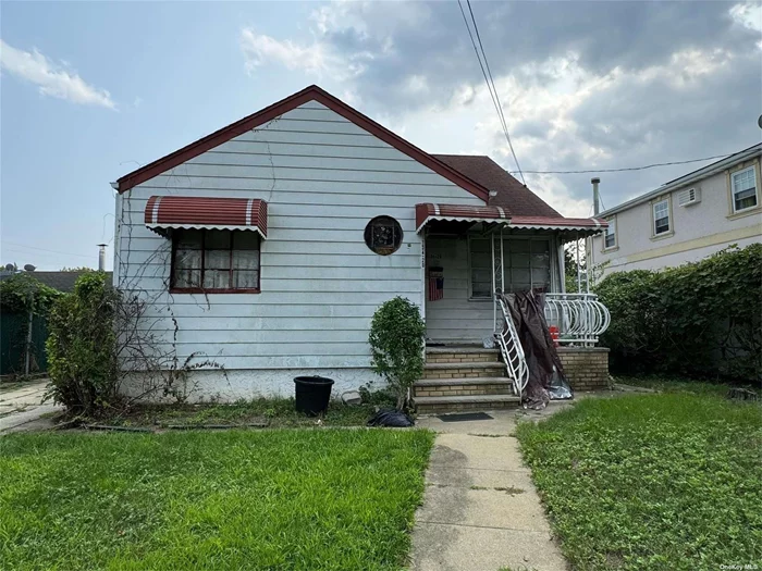 Detached 3 bedroom Cape with 2 full baths, Eat-In-Kitchen and full basement in need of TLC. Large lot, private driveway, R3-2 Zoning in ideal South Ozone Park location. Builders welcome!