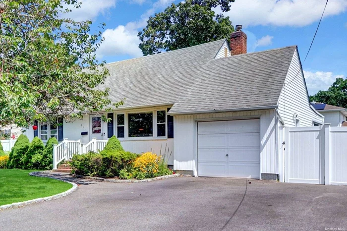 Welcome to this beautifully renovated charming Cape Cod, This homes offers a blend of classic appeal and modern upgrades, The interior boasts new wood floors creating a warm atmosphere through out this spacious 4 bedrooms, 2 full baths newly renovated kitchen is designed for both style and functionality . A bright sunroom off the dining room adds extra living space perfect for relaxing or entertaining with access to garage, new driveway, partially finished basement w/ OSE , plenty of storage & laundry .Yard is fully fenced with a new paver patio great space for entertaining